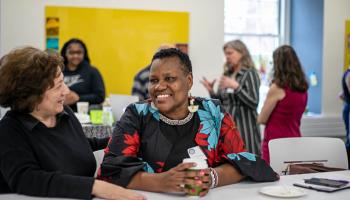 UVA Swahili instructor Leonora Anyango greets a colleague at the Consortium for Less Commonly Taught Languages' anniversary event.