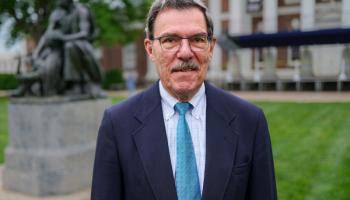 UVA Classics professor John Miller on the Lawn in front of the Homer statue.