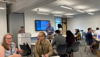 A&S staff managers socialize during a training workshop break.