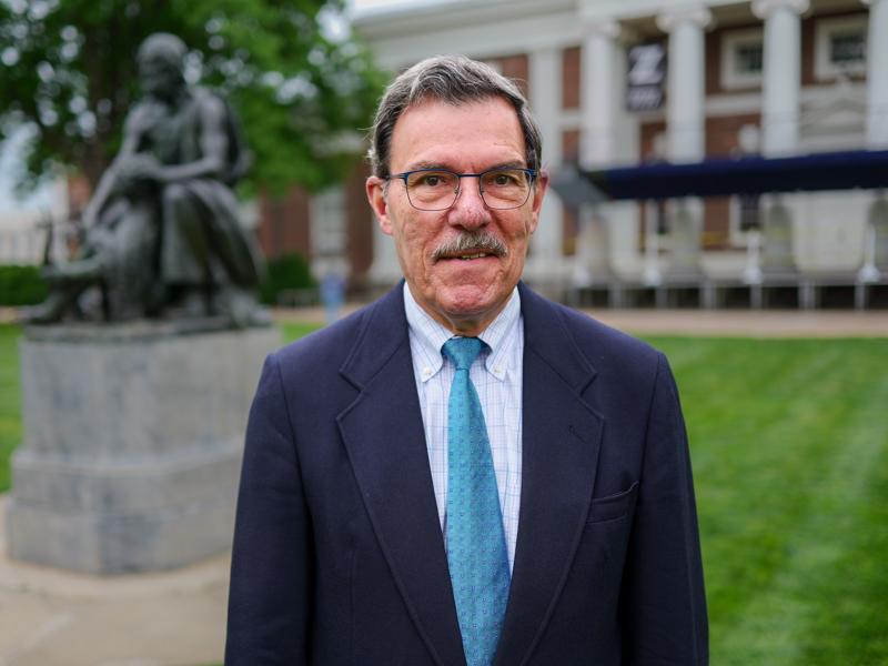 UVA Classics professor John Miller on the Lawn in front of the Homer statue.