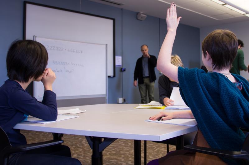 Math professor Slava Krushkal with 4th- and 5th-grade students in class at the UVA Math Circle program.