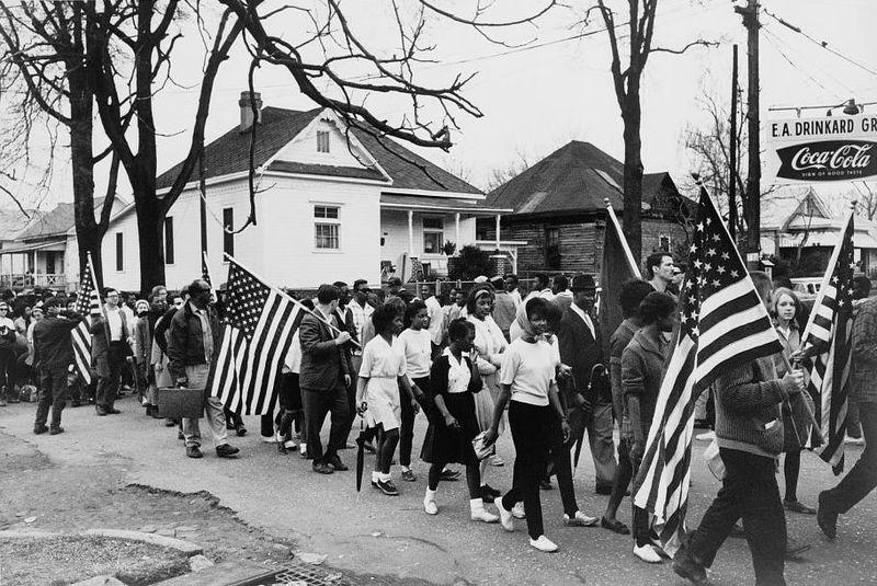 Protestors march from Selma to Montgomery, Alabama to dramatize the fight for voting rights. Within five months, President Lyndon Johnson signed the 1965 Voting Rights Act.