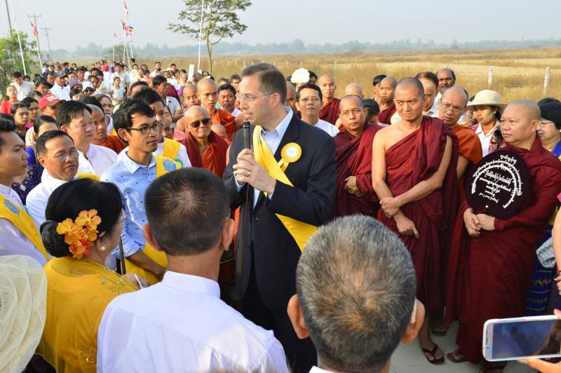 “It is a high calling, and an enormous challenge to do well, which makes the job even more appealing to me,” said Mitchell, pictured here attending the opening ceremony for Buddhist school Sitagu Sotujana University outside of Rangoon, Burma.