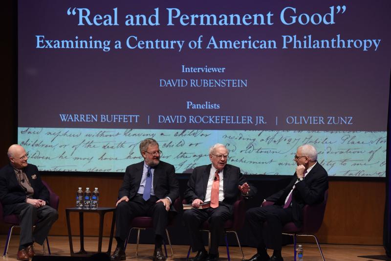Olivier Zunz (left), a history professor at the University of Virginia, philanthropist David Rockefeller Jr. (second from left), Warren Buffet (center), chairman of the investment house Berkshire Hathaway, and philanthropist David Rubenstein