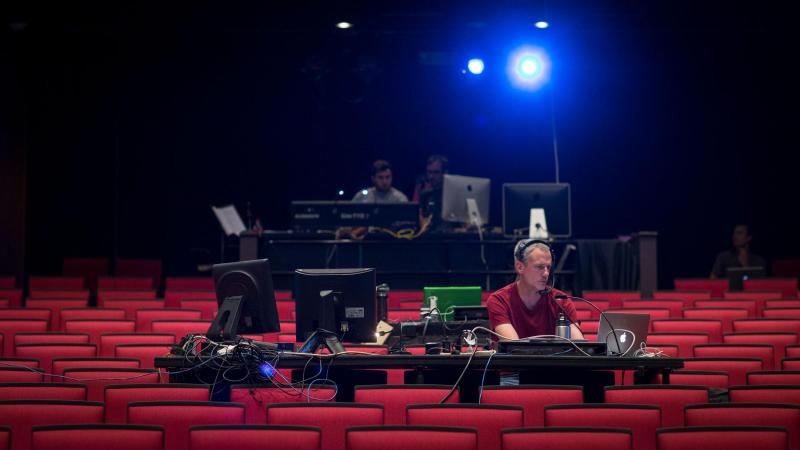 Associate professor of lighting design R. Lee Kennedy monitors stage lighting during the rehearsal. The festival offers UVA drama students further opportunities to work alongside their professors and professional actors, directors, designers and technicia