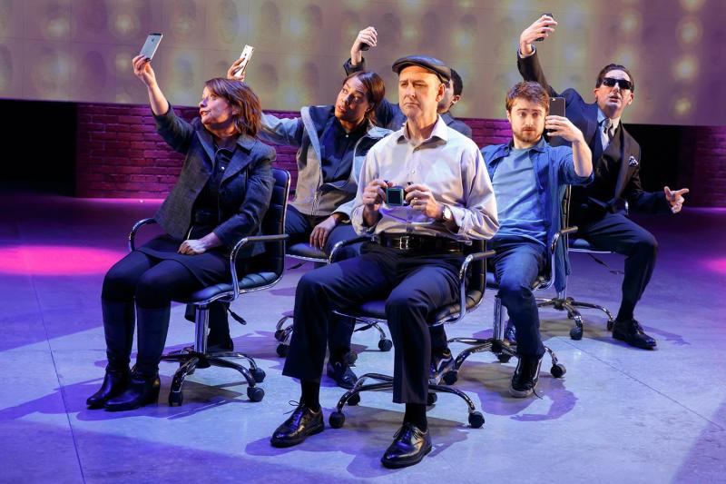 “Privacy” cast members take selfies on stage. From left to right: Rachel Dratch, De’Adre Aziza, Michael Countrymen, Daniel Radcliffe and Reg Rogers. Raffi Barsoumian sits in the back left.