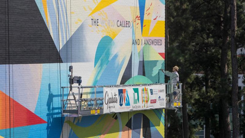 UVA students have long been interested in public art on the Corner, and had previously asked the Charlottesville Mural Project about adding murals to walls abutting the nearby railroad tracks. Railroad regulations preclude that possibility, but the hotel
