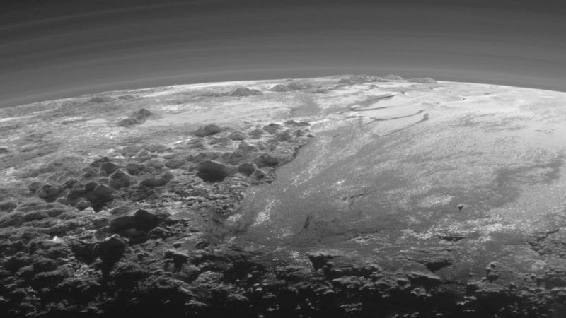 Just 15 minutes after its closest approach to Pluto on July 14, New Horizons looked back toward the sun and captured a near-sunset view of the rugged, icy mountains and flat ice plains extending to Pluto’s horizon. 