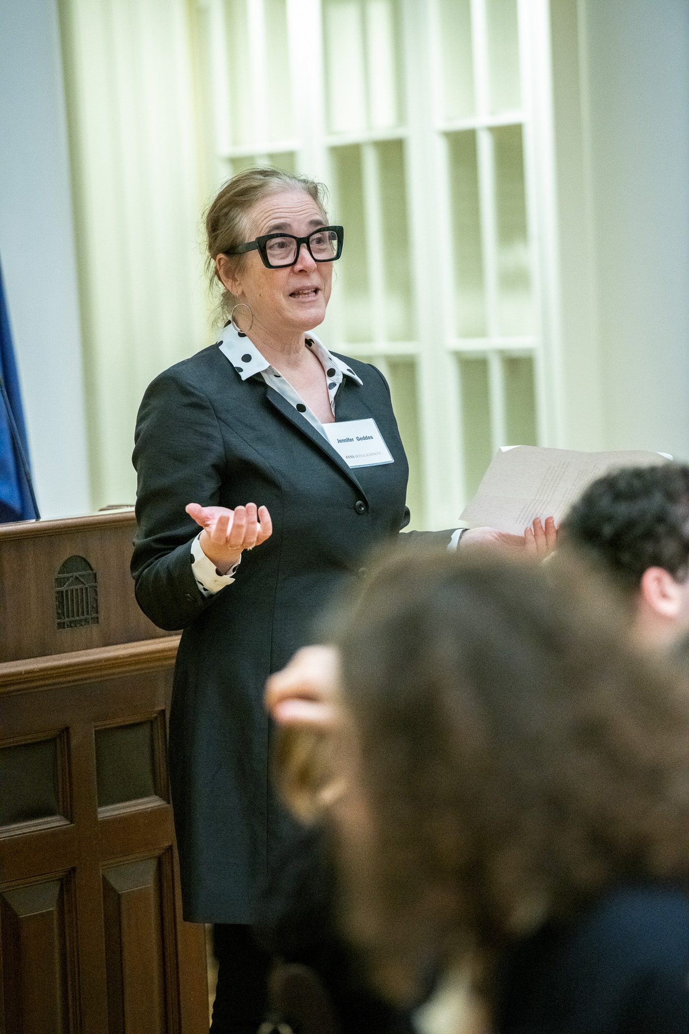 UVA associate professor Jennifer Geddes speaking to a dinner audience in the Dome Room of the Rotunda.