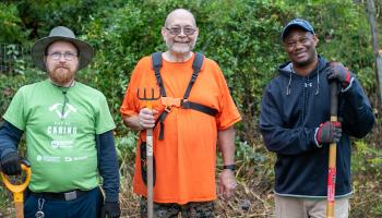 Three United Way Day of Caring volunteers from A&S Computing Services pose for a photo at PVCC Community Garden.